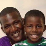 Darren Sammy with his son