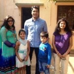 Aditya Srivastava with his wife and children