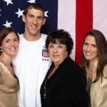 Michael Phelps with his mother and two sisters