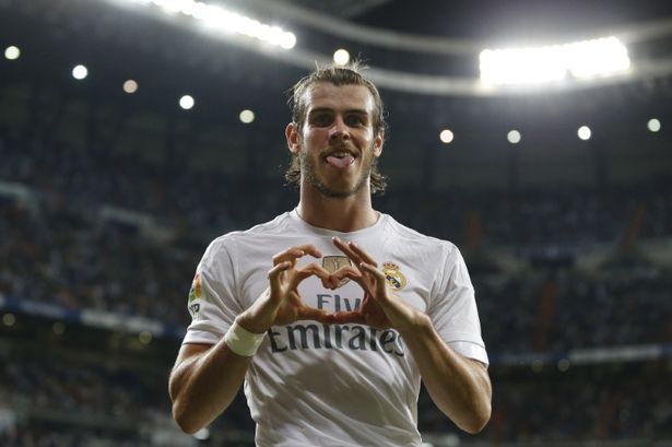 Gareth Bale with his signature celebration symbol