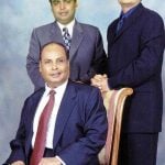 Dhirubhai Ambani (sitting) with his sons Mukesh (left) and Anil (right)