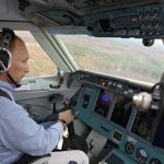 Vladimir Putin co-piloting a plane