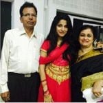 Neethusha Cherckal with her parents