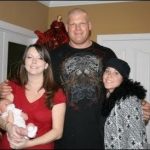 wrestler Kane with his daughters
