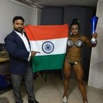 Bhumika Sharma Holding the Tricolour and Her Miss World Bodybuilding Trophy