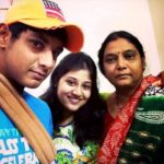Ricky Bhui with his mother and sister