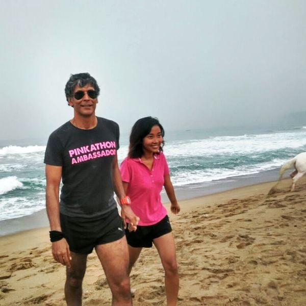 Milind Soman and Ankita Konwar at a beach in 2016