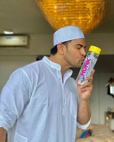 Sahil Khan kissing the bottle of his water label Hunk