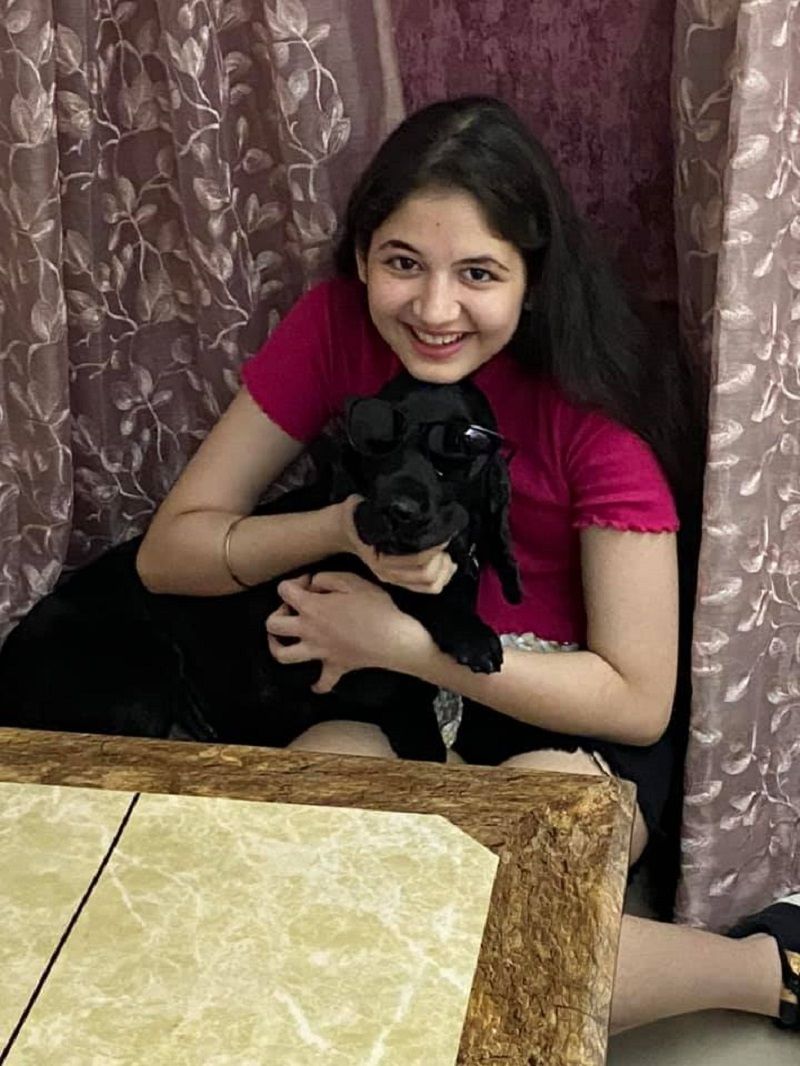 Harshaali Malhotra with her dog, Leo