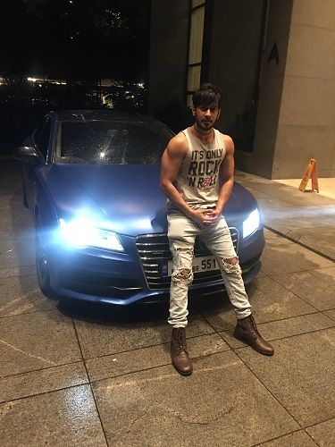 Rishabh Sinha with his car