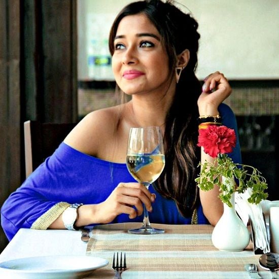 Tina Datta with a glass of wine
