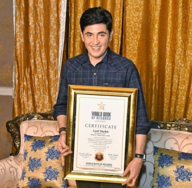 Aasif Sheikh posing with the certificate from the World Book of Records, London