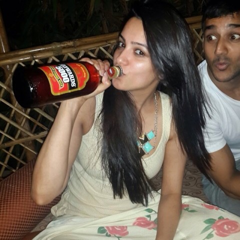 Anita Hassanandani with a bottle of alcohol
