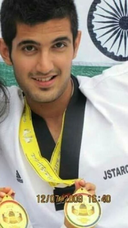 Aditya Seal wearing his gold medal he won at a Taekwondo champion