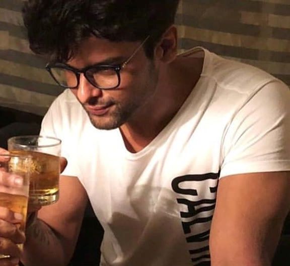 Kushal Tandon with a glass of alcohol