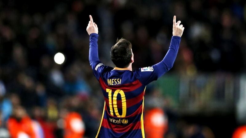 Lionel Messi looking up to the sky after scoring a goal