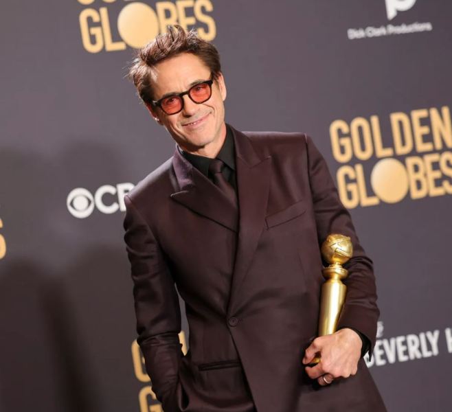 Robert Downey Jr. while posing with the Golden Globe Award (2024)