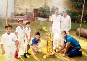 Saqib`s cricket coach teaching underprivileged children