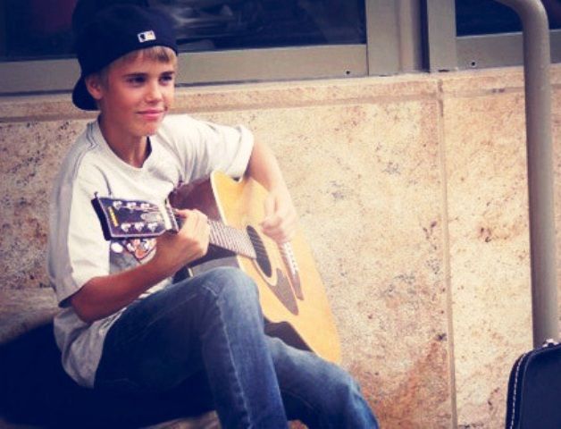Justin Bieber playing the guitar