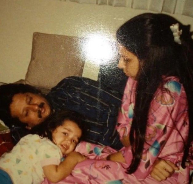 An old photograph of Pankaj Udhas and Farida Udhas with their daughter