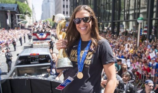 Carli Lloyd with the Golden Ball Trophy