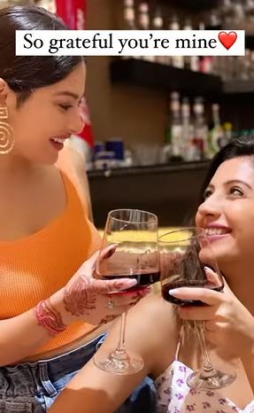 Krishna Mukherjee enjoying wine with her friend