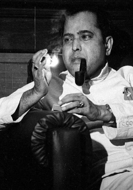 An old photo of Pranab Mukherjee smoking pipe