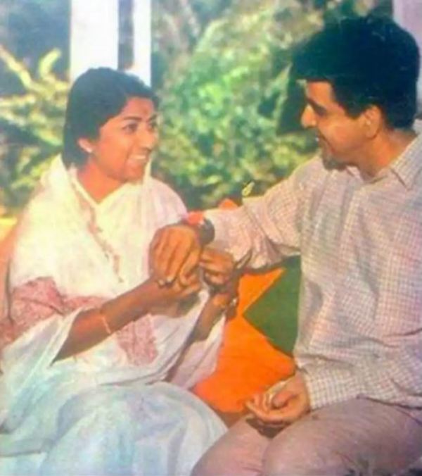 Lata Mangeshkar tying Rakhi to Dilip Kumar