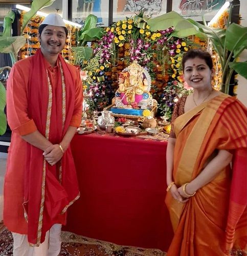 Shreyas Talpade and his wife with an idol of Lord Ganesha