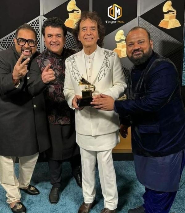 Zakir Hussain, along with other band members, at the 66th Annual Grammy Awards