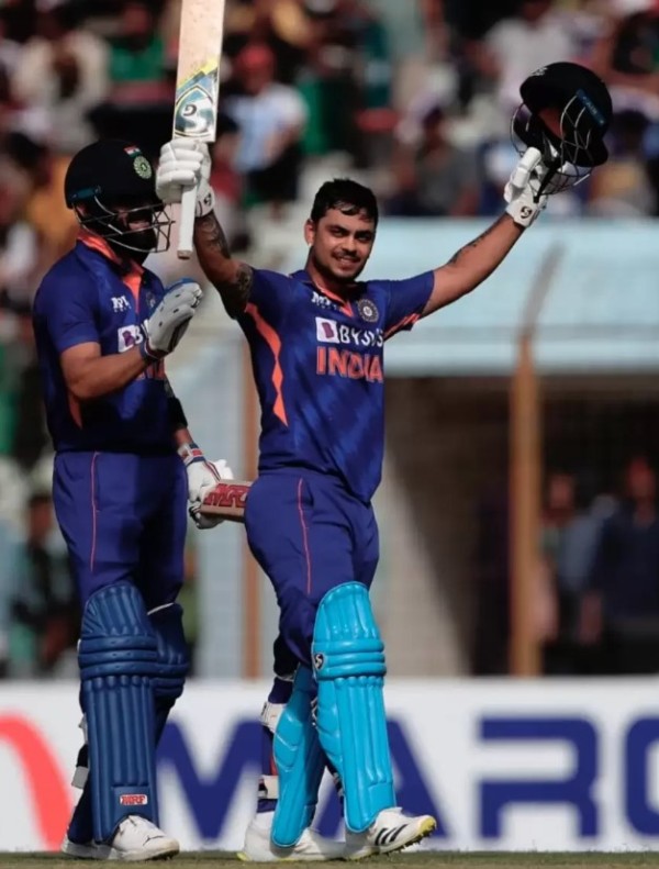 Ishan Kishan celebrating his ODI double century while Virat Kohli pats him on the back