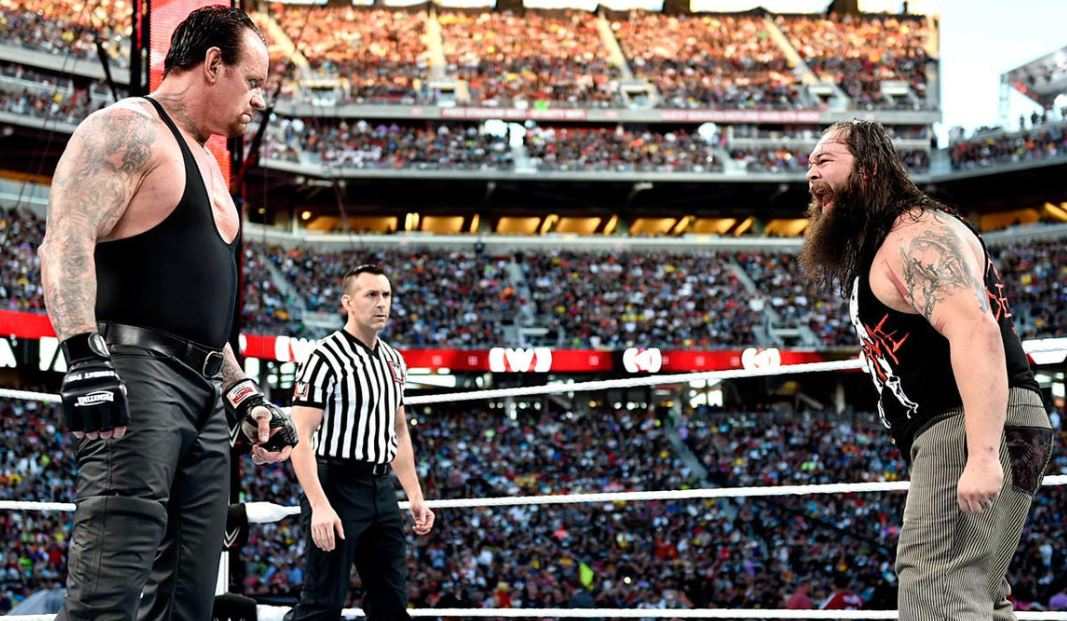 Bray Wyatt (right) with The Undertaker