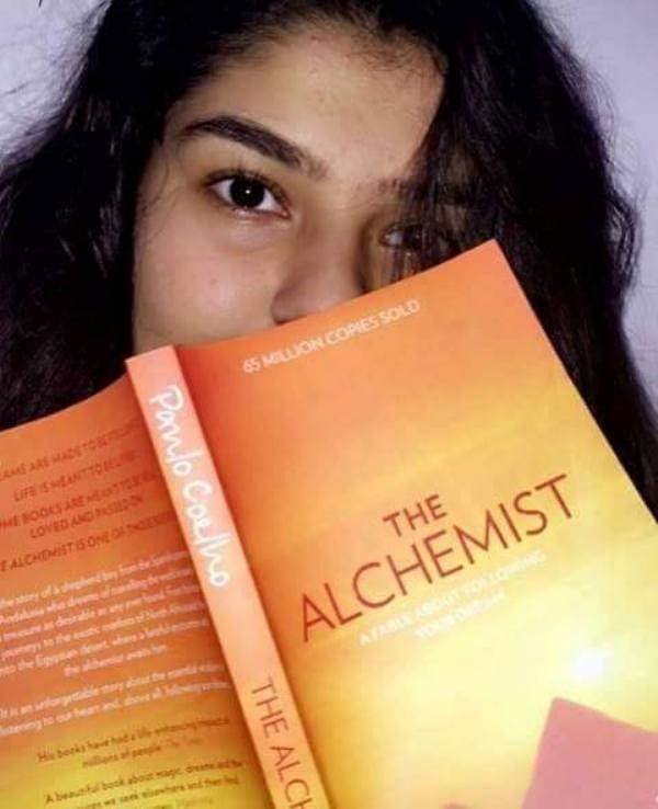 Nidhi Bhanushali Reading The Alchemist