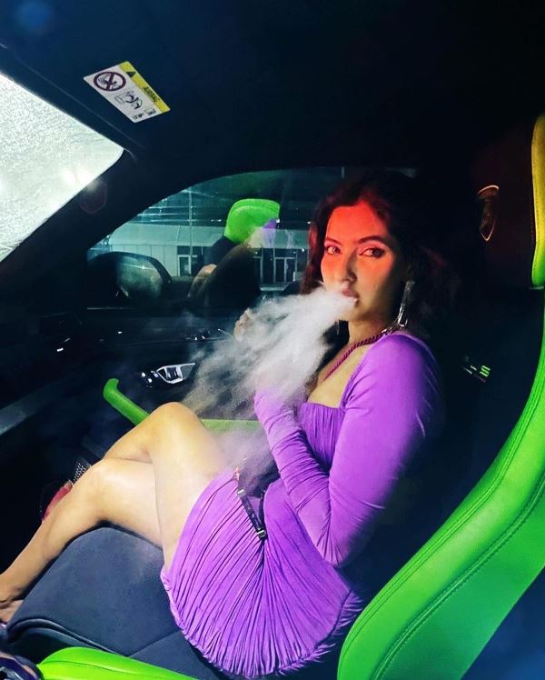 Karishma Sharma smoking in a car