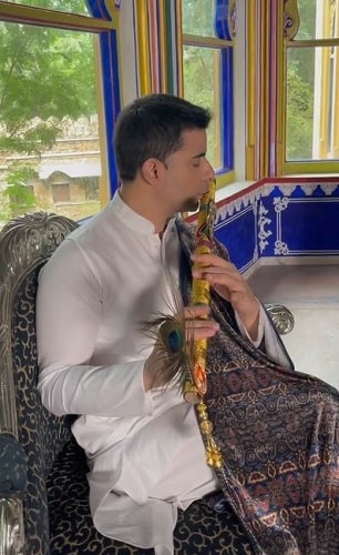 Gautam Rode playing a flute