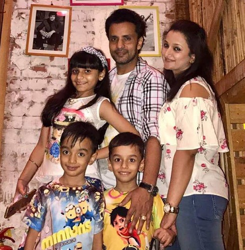 Rajiv Thakur with his wife and children