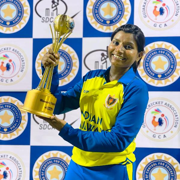 Rajeshwari Gayakwad posing with the BCCI Women's T-20 (2021-2022) trophy