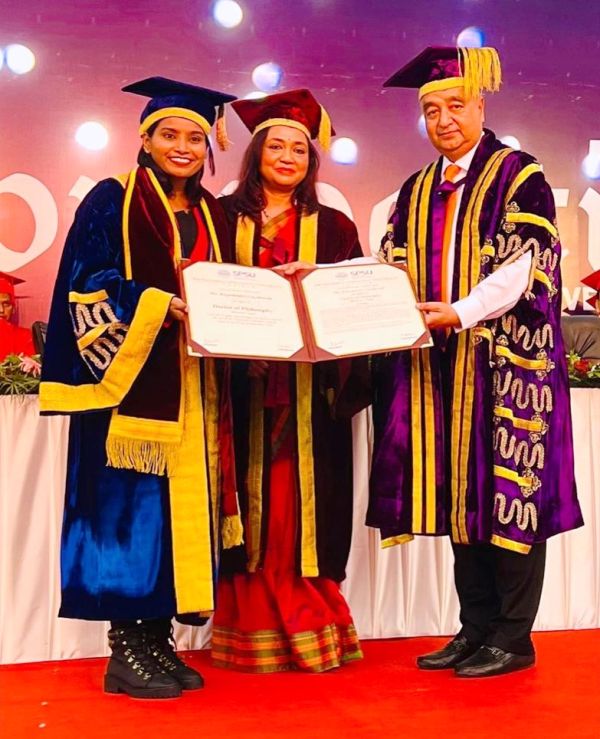 Rajeshwari Gayakwad receiving an Honorary Doctor of Philosophy Degree from Sir Padampat Singhania University's faculty in November 2022