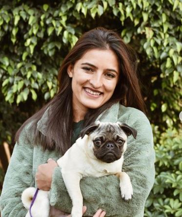 Sushma Verma posing with her pet dog