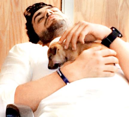 Aly Goni with his pet dog