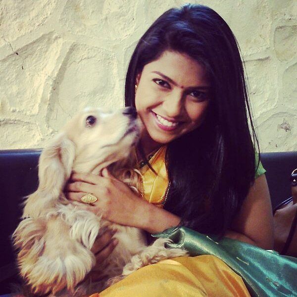 Swarda Thigale Posing With Her Pet Dog