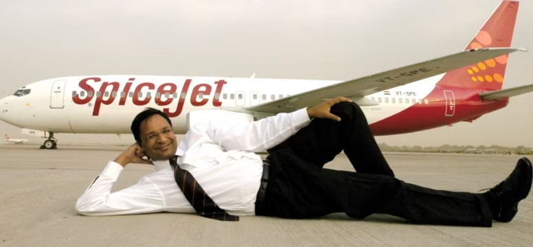 Ajay Singh posing with a SpiceJet aeroplane