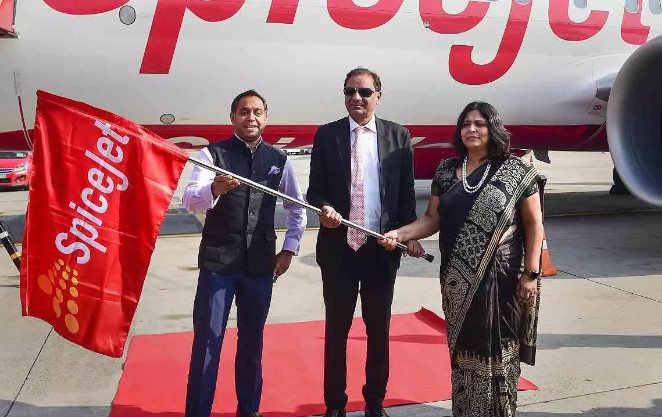 Ajay Singh while unfurling the flag of SpiceJet