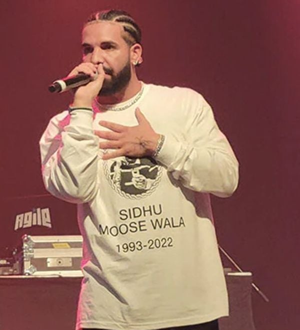 Canadian Drake performing at a concert in Toronto, wearing a T-shirt with a picture of Sidhu Moose Wala