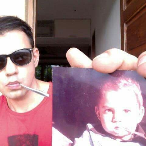 Cyrus Sahukar holding his childhood image