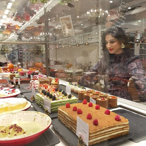 Donal Bisht looking at desserts in a shop
