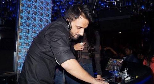 Ali Merchant as a DJ at a party