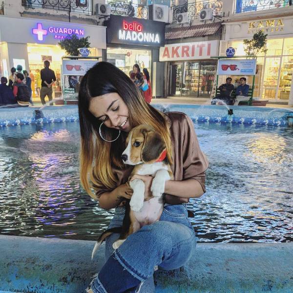 Komal Pandey Playing With A Dog