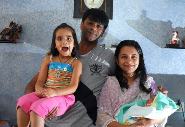 Tanmay Vekaria with his wife and children