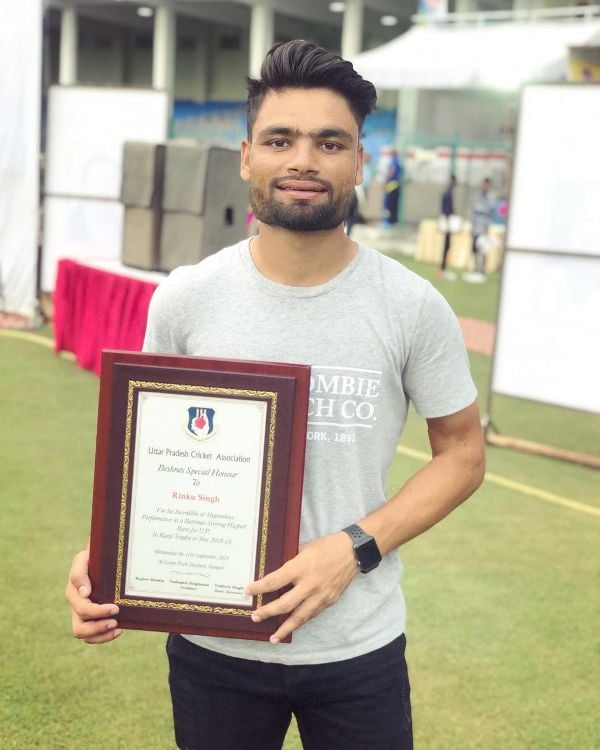 Rinku Singh with the award given to him for scoring maximum runs for Uttar Pradesh in the 2018-19 Ranji Trophy
